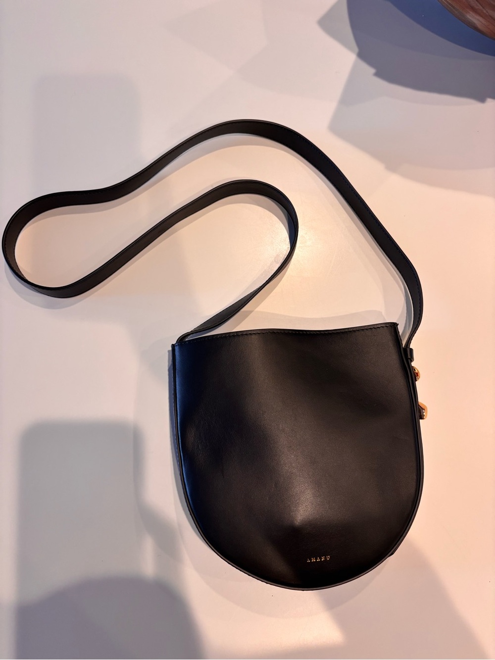 Black Half-Moon Leather Crossbody Bag with Gold Accents - Picture 6 of 6